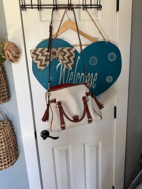 Dooney & Bourke Cream Satchel with Brown Trim and Red Interior Peek